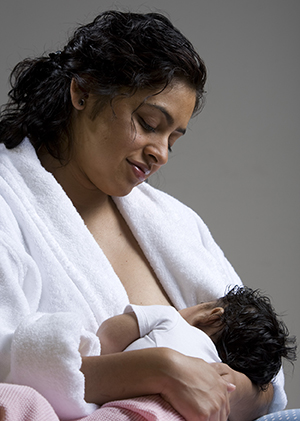 Mother breastfeeding infant.